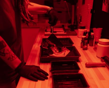 side-view-woman-developing-photos